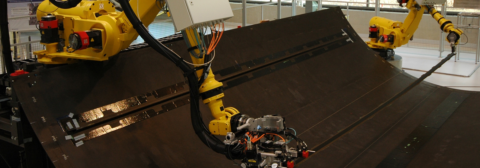 R-2000 robot bonding stringers into a composite structure 